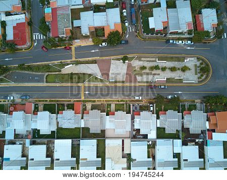 Broadwalk in residential area aerial above view. Park in city district