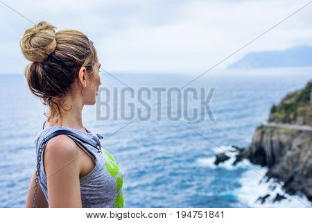 Tourist Girl in Cinque terre Italian riviera. Sea and mountain view. Cinqueterre Liguria beauty