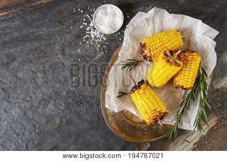 Corn Grilled With Salt And Spices. Dark Background. Fast Food In