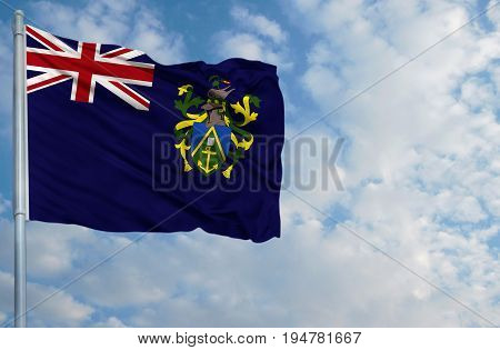 National flag of Pitcairn Island on a flagpole in front of blue sky.
