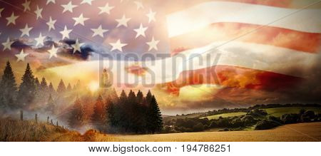 Flag of America on pole against country scene