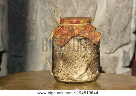 Dried mushrooms - Macrolepiota procera on wooden board