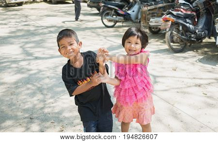 Songkhla Thailand - April 8 2017 : Boy and girl having fun together at Wat Kongkawadee in Songkhla Thailand