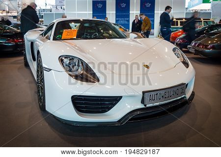 STUTTGART GERMANY - MARCH 17 2016: Mid-engined plug-in hybrid sports car Porsche 918 Spyder 2015. Europe's greatest classic car exhibition 