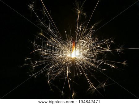 Close up fire spark with black background.