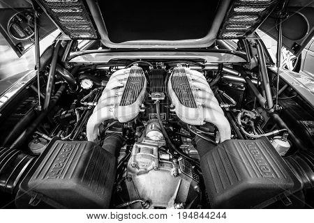 STUTTGART GERMANY - MARCH 18 2016: Engine of sports car Ferrari F512 M Testarossa 1995. Black and white. Europe's greatest classic car exhibition 
