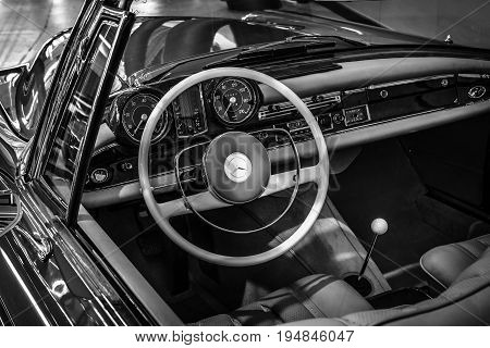 STUTTGART GERMANY - MARCH 18 2016: Cabin of Mercedes-Benz 220 SE (W128) cabriolet 1962. Black and white. Europe's greatest classic car exhibition 