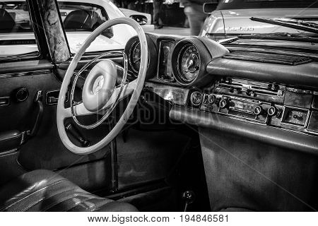 STUTTGART GERMANY - MARCH 18 2016: Cabin of full-size luxury car Mercedes-Benz 280 SE 3.5 Coupe (W111) 1970. Black and white. Europe's greatest classic car exhibition 