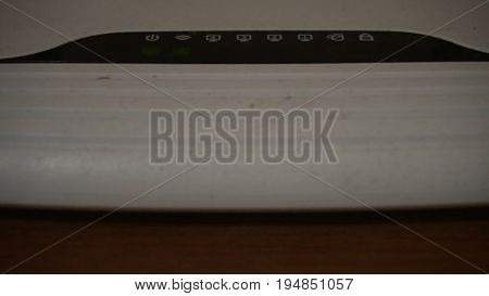 Close-up VIew of Wi-Fi Router Blinking Lights.