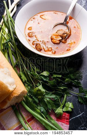 Vegetables And Meat In Red Beetroot Soup Or Borsch In White Plate With Metal Spoon In It On Dark Mar