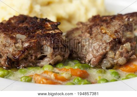closeup of bavarian homemade meatballs with mashed potato
