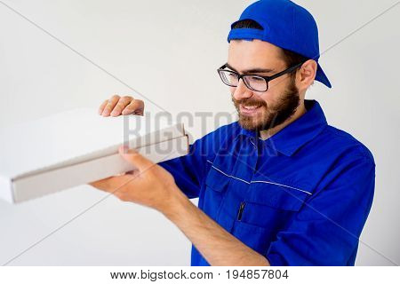 Pizza delivery service concept: delivery guy bringing pizza box
