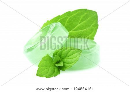 Candies for the throat with sprig of mint isolated on a white background.