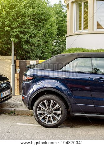 STRASBOURG FRANCE - MAY 30 2017: Detail of the rear part of an Range Rover Evoque SUV parked on street in luxury neighborhood