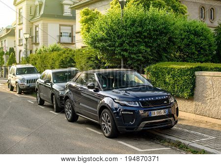 STRASBOURG FRANCE - MAY 30 2017: Range Rover Evoque SUV parked on street in luxury neighborhood