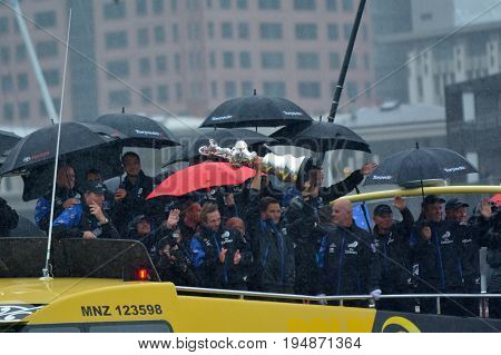 AUCKLAND - JULY 06 2017: Fans welcome home Team New Zealand and the Auld Mug America's Cup Trophy in downtown Auckland New Zealand.