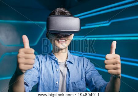 man wear vr and thumb up on the technology background