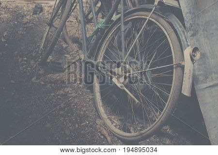 old bilk wheel abandoned or old bicycle wreck.
