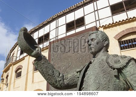 Lorca Spain - May 29 2017: Historic bullfight arena in Lorca with monument to the famous torero Pepin Jimenez. Province of Murcia Spain