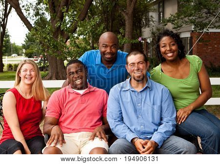 Happy commuinity group of people talking and laughing.