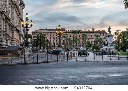 Rome Italy - August 18 2016: Sunset on Piazza Cavour in Rome near Castel Sant Angelo. The monument in the center of the square is the Count Cavour (by S.Galletti) was erected in 1895 in occasion of 25th anniversary of Rome as a capital of the state.