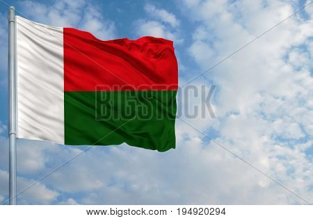 National flag of Mari El on a flagpole in front of blue sky.