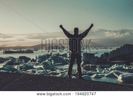 Man explorer lookig at Jokulsarlon lagoon, Iceland.