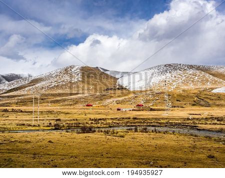 View of rural houses at the snow mountain in Sichuan China