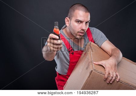 Mover Man Holding Box And Cutter Tool Looking Serious