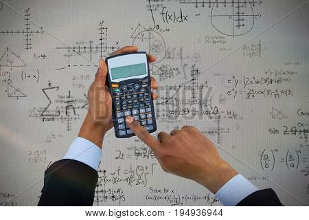 Cropped hands of businessman using calculator  against quadratic equations with solution