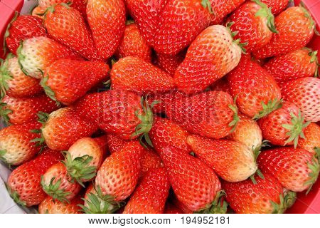 Fresh strawberry seen from top for use as abckground.