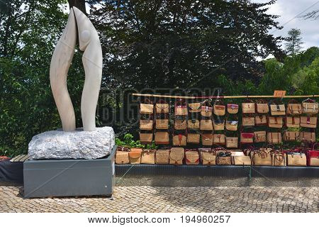 Sintra Portugal - June 6 2017: Sale of souvenirs handbags of cork on the streets of Sintra. Products from the cork tree is one of the most popular souvenirs in Portugal
