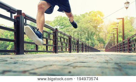 running man. Male runner at sprinting speed training for marathon outdoors.