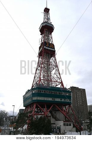 SAPPORO, JAPAN- FEBRUARY 11, 2017: Sapporo TV Tower (at Odori park in Sapporo, Hokkaido, Japan) with snow on floor and clear sky background, taken on February 11, 2017 during Sapporo Snow Festival