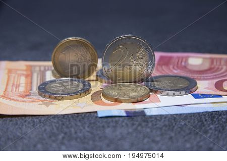 Euro money and coins on the grey table