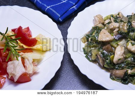 Chicken meat with mushroom and spinach sauce with salad