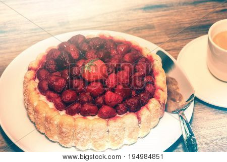 Birthday cake with fresh raspberries and coffee cup. Sweet food background