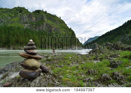 Stone pyramid near Katun river in Altay mountains. Chemal Altay Republic Siberia Russia.