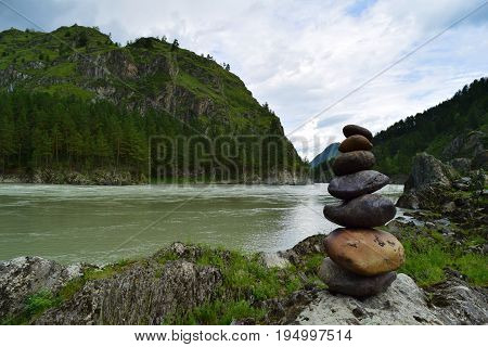 Stone pyramid near Katun river in Altay mountains. Chemal Altay Republic Siberia Russia.