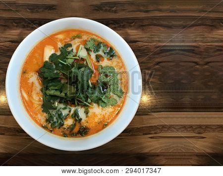 Shanghai Hot Sauce Noodles In Red Soup Bowl On Wood Table Background.