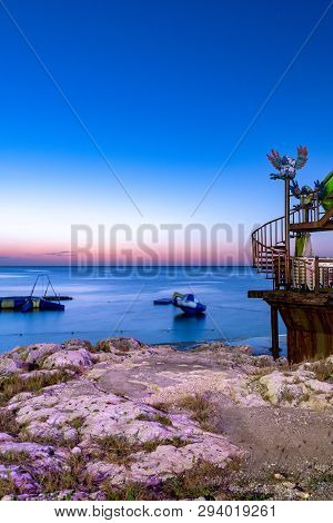 Montego Bay - April 06 2019: Beautiful Sunset Afterglow Behind Water Trampolines On The Ocean At Mar