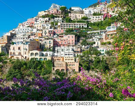 View Of The Colorful Houses Of Positano Framed With Flowers