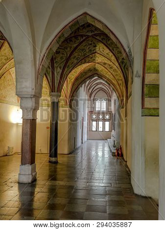 MALBORK, POLAND - 15 AUGUST, 2013: Gothic cloister of Teutonic Malbork castle, Poland. Malbork castle is the largest brick fortress in the world