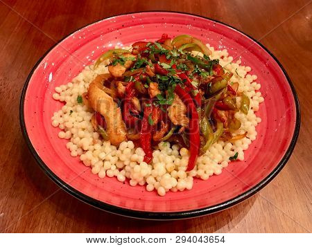 Couscous With Bbq Chicken And Vegetables Served At Restaurant / Kuskus