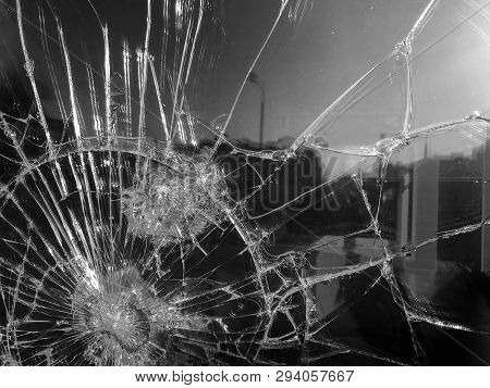 The Texture Of The Broken Cracked Thick Fragile Broken Sharp Glass, Triplex With Shiny Small Fragmen