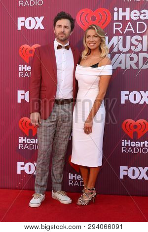 LOS ANGELES - MAR 14:  Beau Clark, Stassi Schroeder at the iHeart Radio Music Awards - Arrivals at the Microsoft Theater on March 14, 2019 in Los Angeles, CA