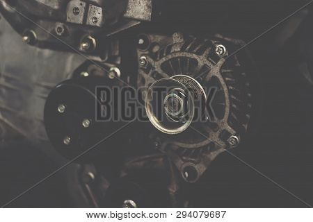 Disassembled Car Dirty Engine And Dynamo At Garage