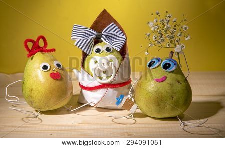 Three Pears Are On The Table.one Pear-mother, The Second Pear-child And The Third Pear - Father.