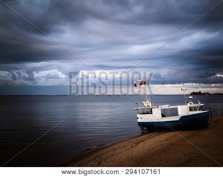 Fishing Boat On Baltic Sea Coast. Stormy Weather. Mechelinki, Poland, Pucka Bay.
