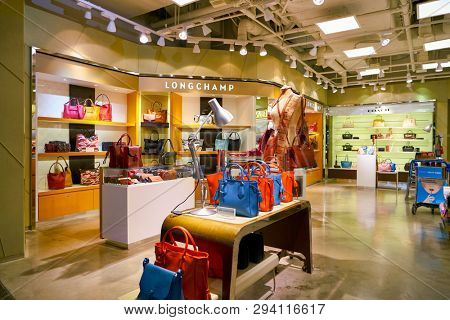 ZURICH, SWITZERLAND - CIRCA OCTOBER, 2018: Longchamp handbags on display at a shop in Zurich International Airport.